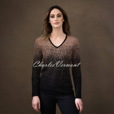 Super soft viscose mix V-neck long sleeve sweater with 2 tone gradient knit effect. V-neck Long Sleeves 2 tone Gradient effect Jacquard knit Classic fit.