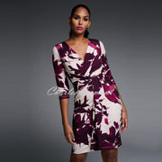 This beautiful wrap style dress features a flattering mock waist belt and fitted waist, and comes in a gorgeous oversized floral print. A fabulous addition to your wardrobe and perfect for occasions. Joseph Ribkoff 'Signature' Dress – Style 223712
